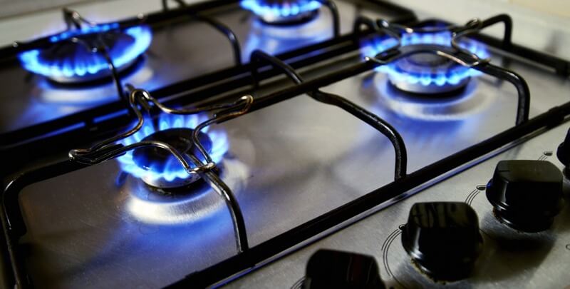 Blue flames from a gas cooktop